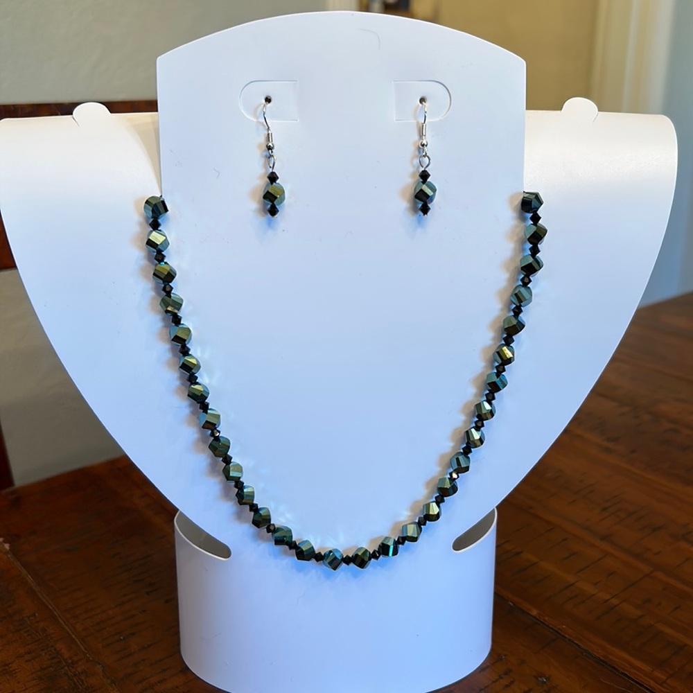 Iridescent green/blue and black crystal necklace and earring set.